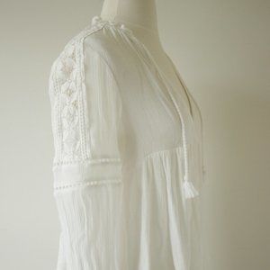 white loose tassel blouse with lace shoulder detail